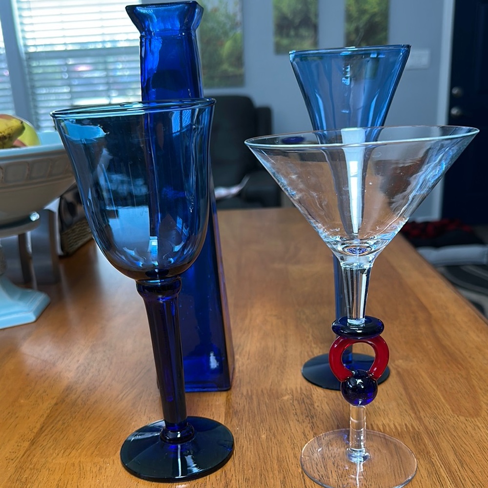 Blue glass bundle. Wine, champagne, martini and vase.
